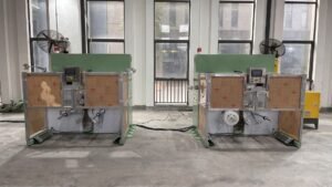 Dual-station winding machine for optical fiber extrusion production