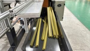 Finished plastic curtain track rail profiles produced by an extrusion line